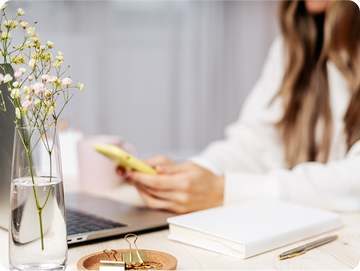 woman with laptop and phone